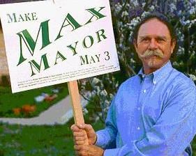 Photo: Max holding a campaign yard sign